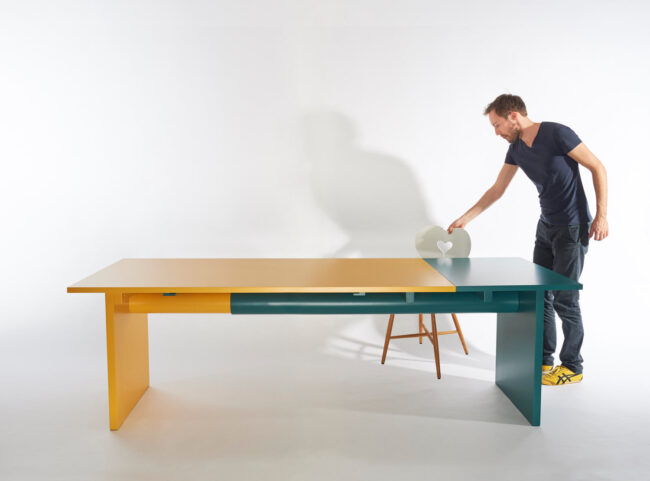 Extendable dining table Pipe-Line in green and yellow with designer Peter Otto Vosding and chair