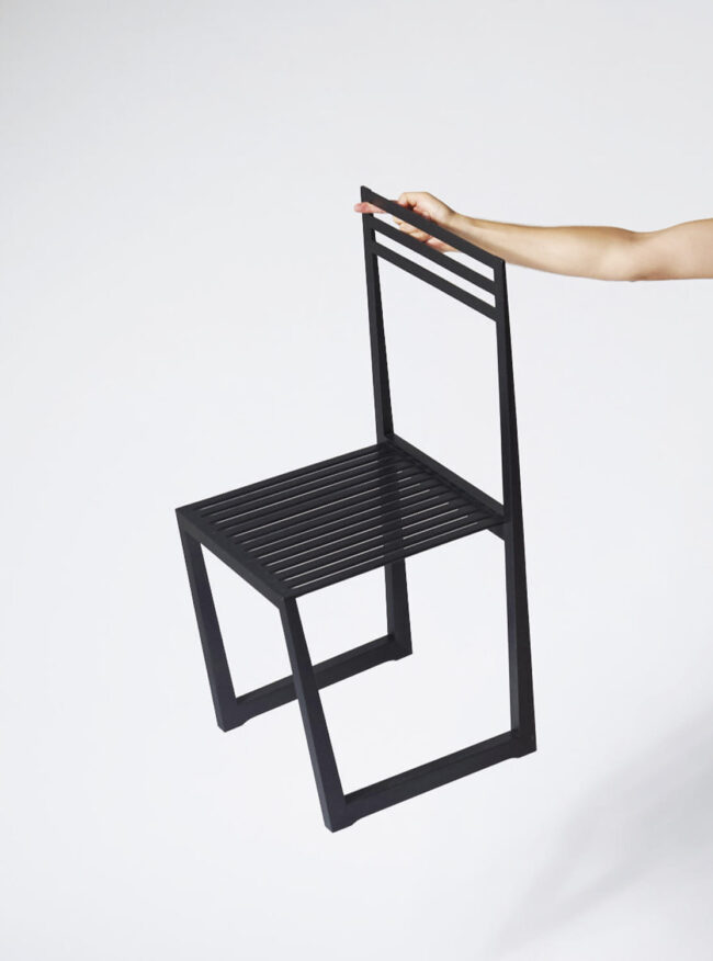 Super lightweight massive wood chair Mµ hanging on a finger